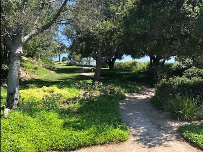 ... and even has its own private walking path lined by oak trees.