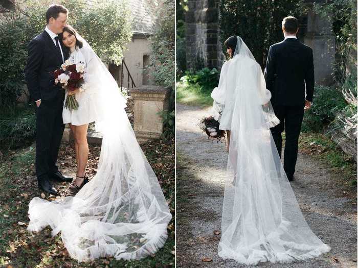 May paired the dress with a floor-length, statement veil.