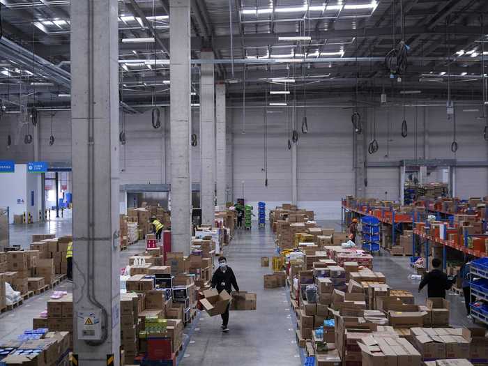 The robots work by picking up packages and moving them to another part of the warehouse, where they can be processed for delivery.