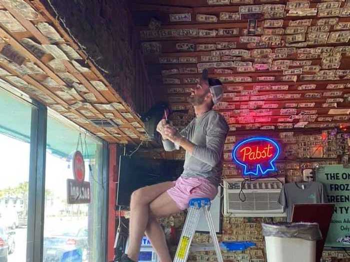 Owners of a Georgia bar took down the dollar bills decorating its walls and ceiling to give to unemployed staffers in April.