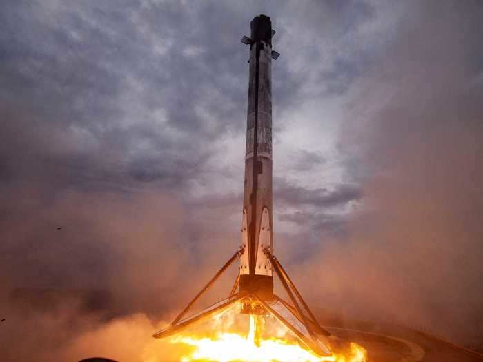 Once the Falcon 9 rocket booster expends most of its fuel, it will detach from the upper stage and attempt to land itself on a boat at sea. That way, it can be reused to fly another day.