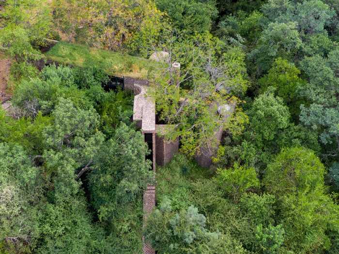 Called The House of the Big Arch, it weaves between the red sandstone cliffs and riverine forest of the Waterberg Reserve about three hours north of the city.