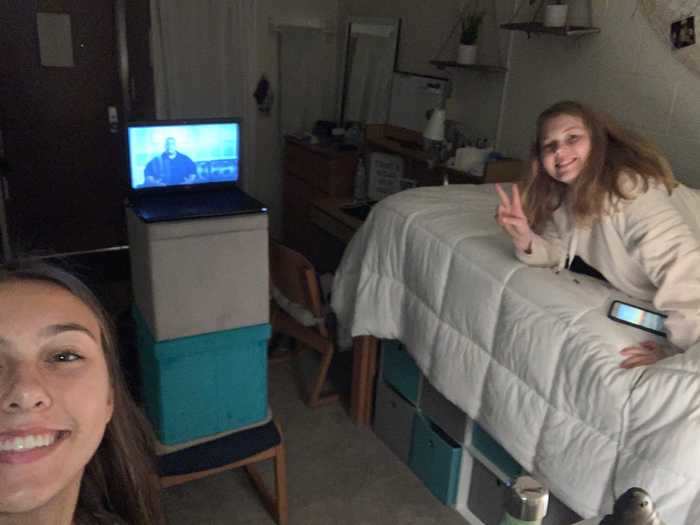 Confined to a dorm room, Emily Lampi, a freshman at the University of Florida, will watch a movie with her roommate.