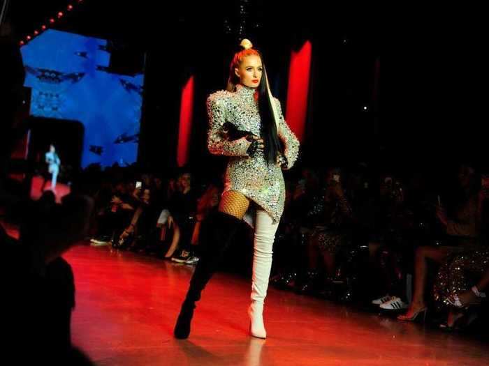 Paris Hilton as Cruella de Vil, and beauty influencer Patrick Starrr as Ursula — NYC luxury brand The Blonds gave a runway show that was a celebration of all things Disney Villains using a diverse cast of models and modern-day queer icons.