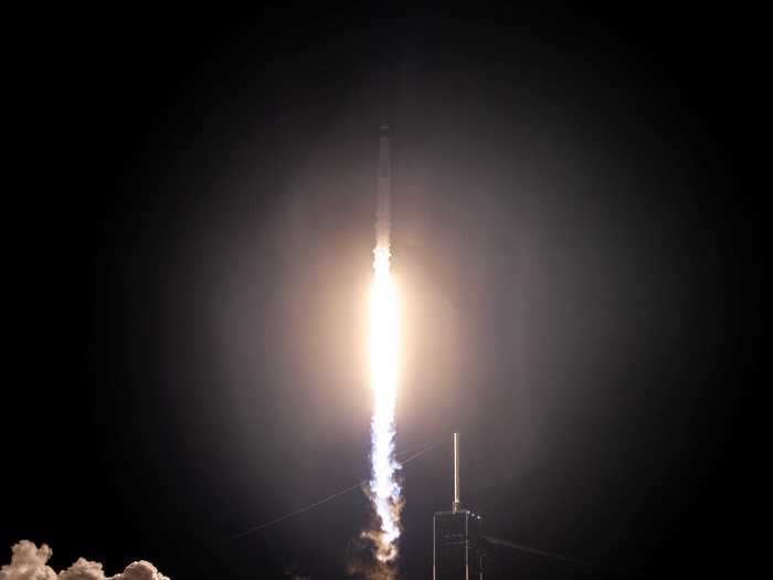 At exactly 15 seconds after 7:27 p.m. ET, the rocket roared past the launchpad.