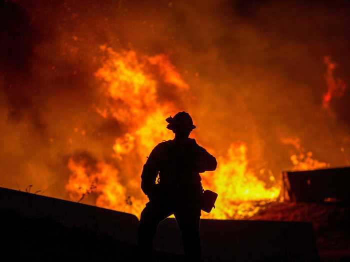 October 26: A firefighter in Yorba Linda, California, watched the Blue Ridge Fire burn.
