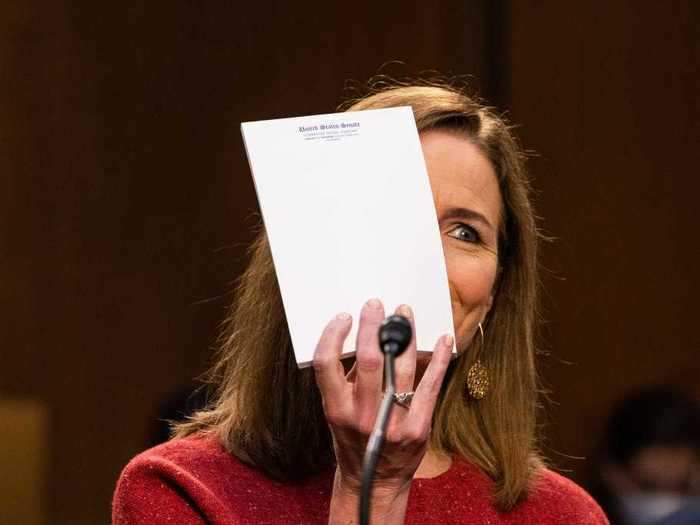 October 13: Judge Amy Coney Barrett held up an empty notepad before the Senate Judiciary Committee.