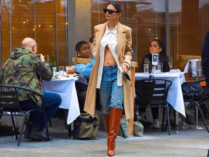 The model showed off her stomach again the following day in a fall-inspired outfit.