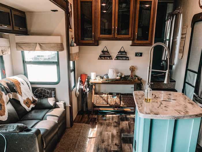 The RV also comes with a full kitchen, a dining area, and a fireplace that doubles as a heater.