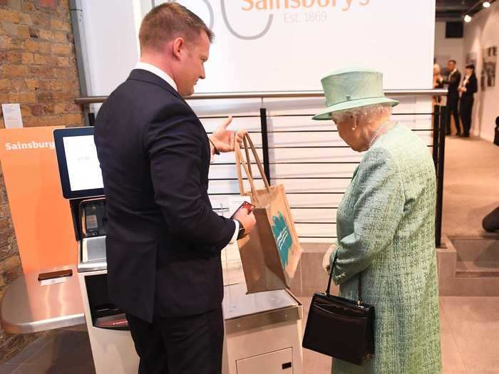 On a visit to another supermarket, the Queen appeared skeptical of the self-checkout phenomenon.