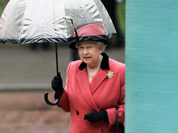 She holds her own umbrella.