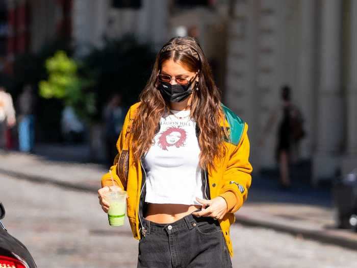 In October, Hadid wore a graphic T-shirt, a Fendi headband, Levi jeans, and chunky shoes.