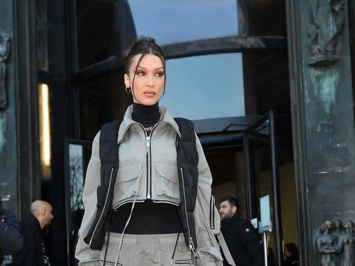 At the Tatras fashion show, Hadid arrived wearing cargo pants and a puffer vest.