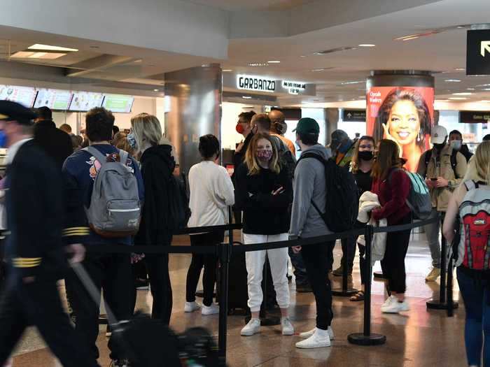 One photo showed a number of people waiting in line at the Denver International Airport