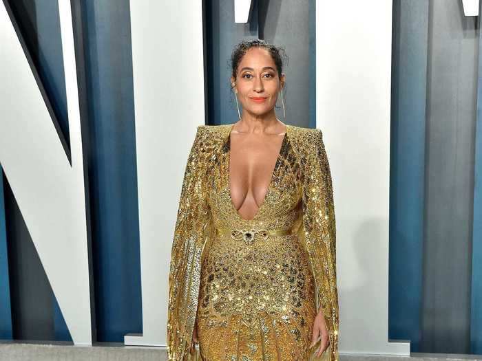 Tracee Ellis Ross put her own twist on glamour in a gold gown with cape-style sleeves.