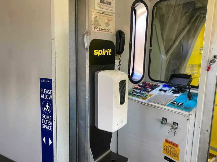 Just before stepping on the plane, however, this Spirit Airlines-branded hand sanitizer dispenser awaited.