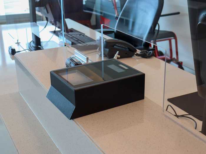 Once at the counter, some airlines are encouraging passengers to aid the check-in process by scanning their own ticket at these machines placed on top of the desk.