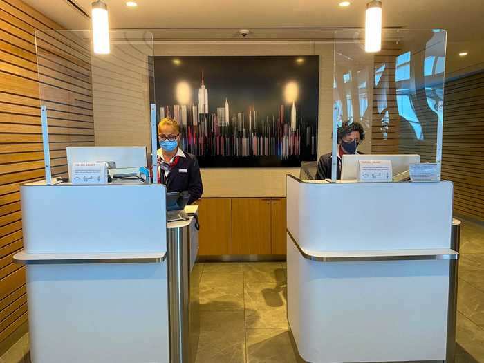 Starting at the lounge check-in, all three airlines have opted to install plexiglass partitions to separate guests from staff.