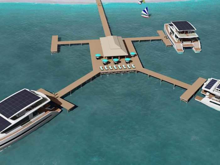 The above-water deck consists of a centralized reception area that then branches out into the individual catamaran docks.