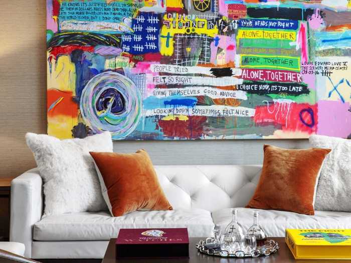 This office has a custom couch and a piece by artist Eddie Love.