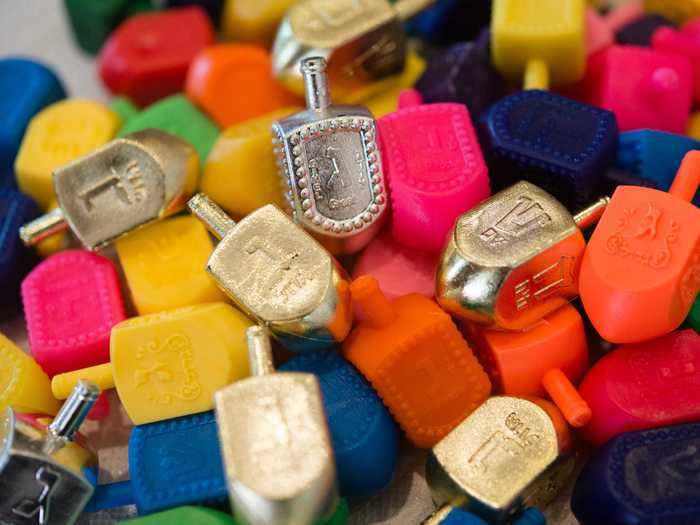 Dreidels, spinning tops with Hebrew letters on them used to play a Hanukkah game, contain different letters depending on where you are in the world.