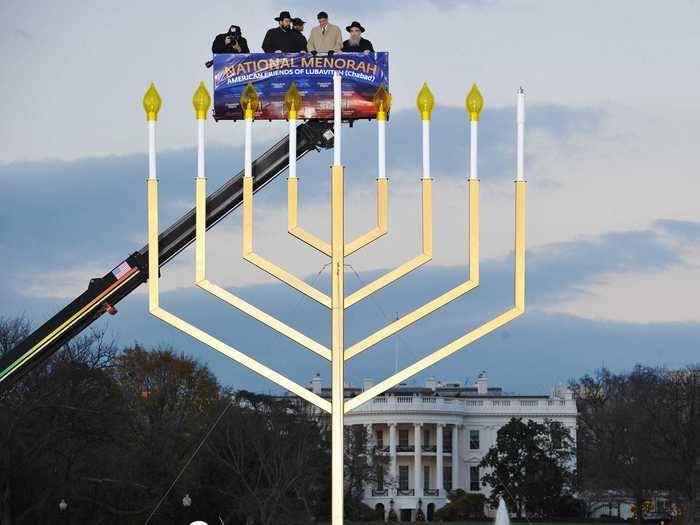 The National Menorah is 30 feet tall and requires a cherry picker to reach high enough to light.