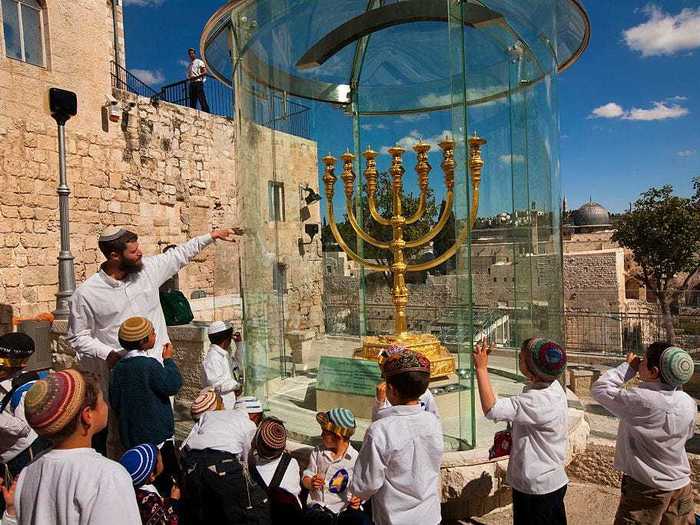 The word "menorah" actually refers to the candelabra with seven branches that was lit in the ancient Temple in Jerusalem.