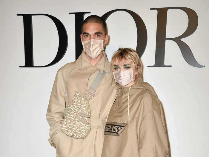 The couple both wore Christian Dior trench coats to the brand