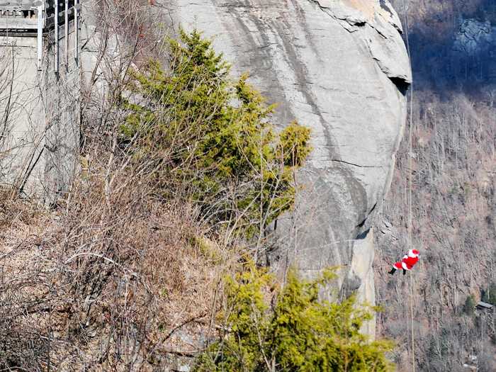 In North Carolina, Santa Claus rappels down the biggest chimney in the state every year: Chimney Rock!