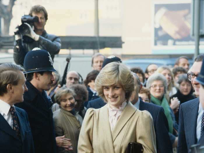 Princess Diana looked prim and proper in this tan, tie-belted Caroline Charles coat.