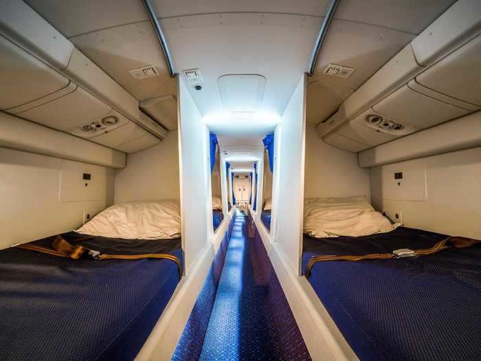 Other planes have partitioned-off beds along an aisle, reminiscent of a cruise ship.