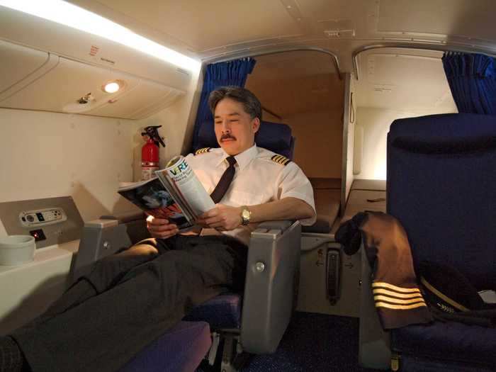 On the Boeing 777, pilots have their own overhead sleeping compartments, which feature two roomy sleeping berths, as well as two business-class seats, and enough room for a closet, sink, or lavatory, depending on the airline.