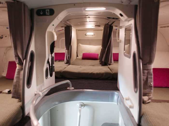 Upstairs are cramped, windowless bedrooms with eight beds (or seven, depending on the airline). This is the cabin