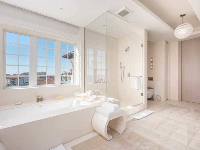 Each of the dual master bathrooms has a large soaking tub as well as a walk-in shower.