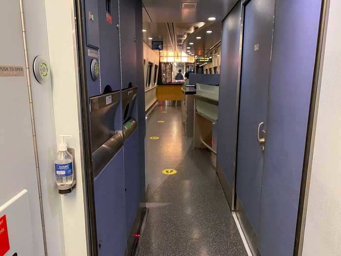 I eventually stumbled on the cafe car in the middle of the train. A hand sanitizer dispenser and social distancing placards guided the way in.