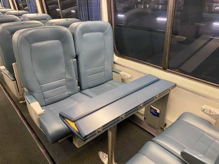 Seats in Acela business class are split between four-seater tables...