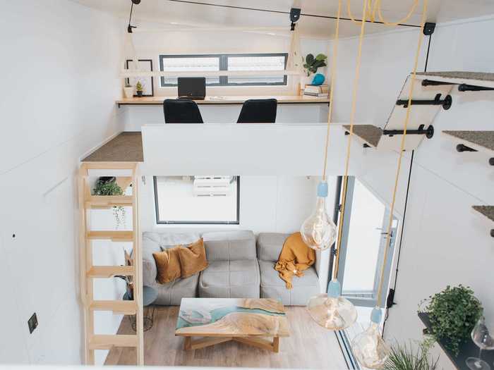 The upstairs office loft can be accessed with a removable ladder that sits in front of the living room.