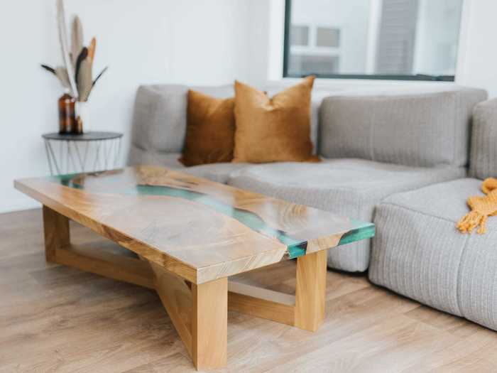 The living room, which sits below the office loft, includes a couch and coffee table.