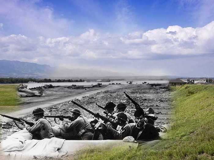 Defenders on Ford Island watch for planes during the surprise attack on Pearl Harbor.