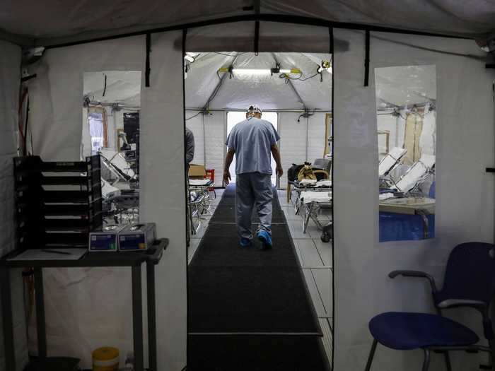 Hospitals have set up extra beds in tents for the overflow of patients.