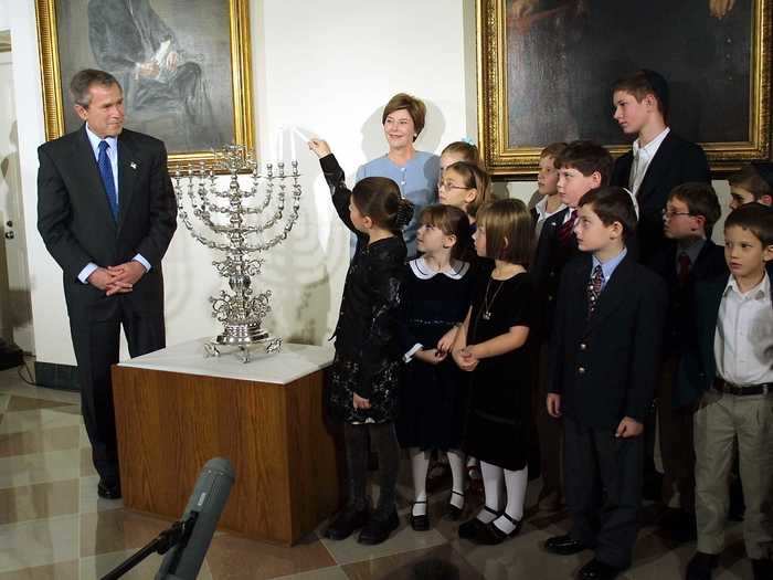 President George W. Bush and first lady Laura Bush hosted the first White House Hanukkah party in 2001. It was the first time a menorah lighting was held in the White House residence.