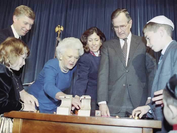 President George Bush and first lady Barbara Bush learned to play dreidel at the White House in 1990.