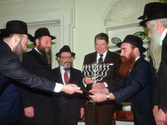 A delegation of rabbis brought President Ronald Reagan a menorah during a Hanukkah visit in 1984.