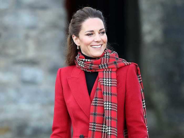 Middleton turned heads when she wore a bright-red Alexander McQueen coat and matching tartan scarf for a visit to Wales.