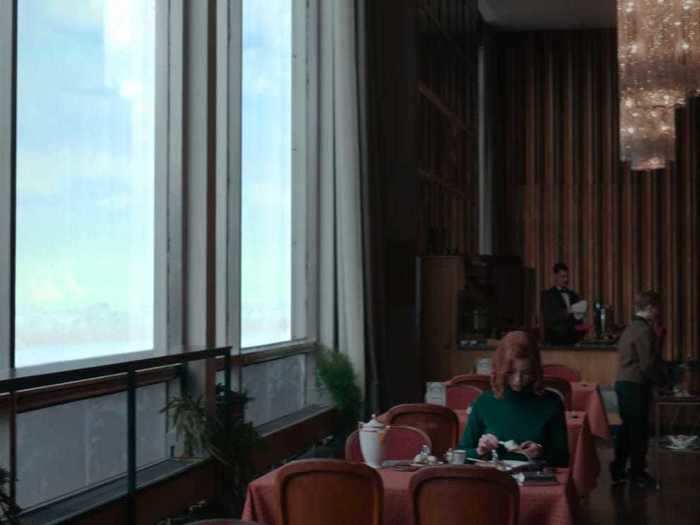 A handful of scenes show Harmon eating at the hotel restaurant, which features floor-to-ceiling windows.