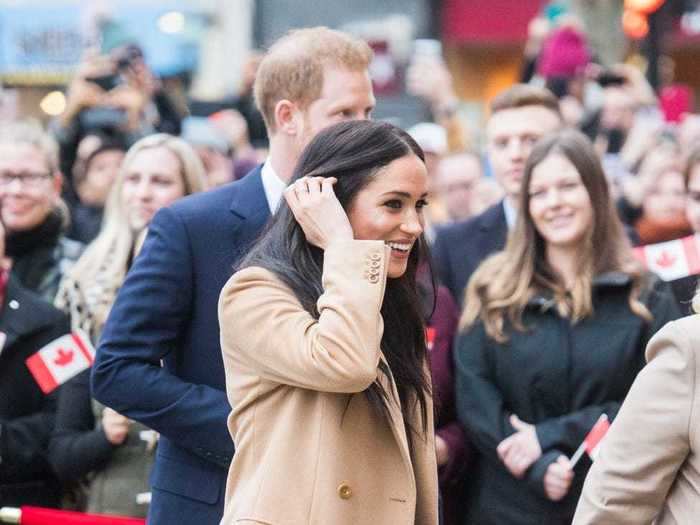 February: Meghan Markle looked stunning in a chic camel-colored jacket, turtleneck sweater, and Massimo Dutti slip skirt.