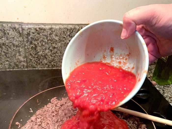 Then I added my San Marzano tomatoes and tomato paste.