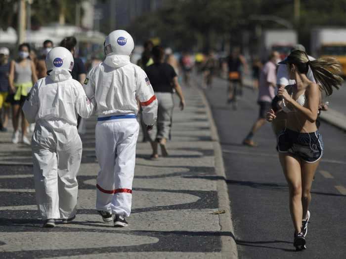 These people wore protective space suits during a beach day in Brazil this July.