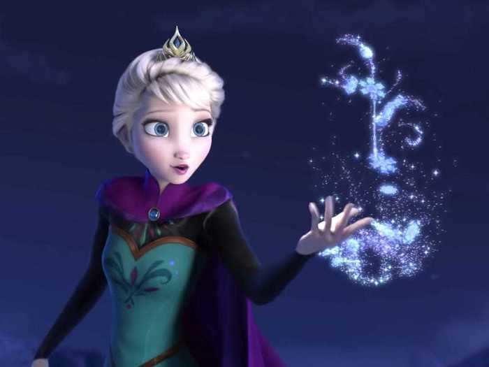 Elsa wears a crown, carries a scepter, and holds an orb for her coronation ceremony.