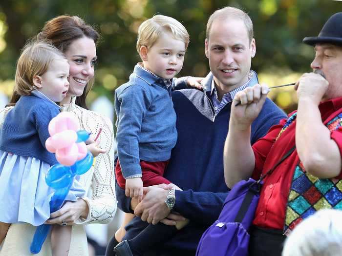 2016: Princess Charlotte and Prince George are mesmerized by an entertainer during the family